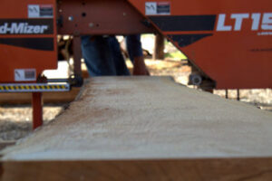 board going thru sawmill